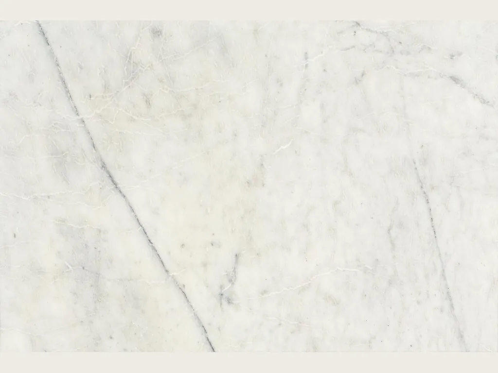 Slab of Silver Glace white marble: an almost flat white background, with sparse fine gray veins crossing in diagonal.