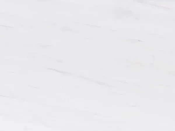 Snow White Marble slab: a very clean white background with faint gray traces running diagonally