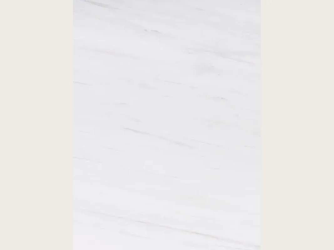 Snow White marble slab: a very clean white background with faint gray traces running diagonally