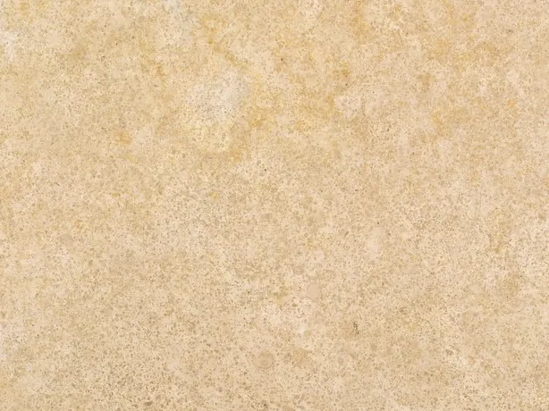 Detail of beige Trani marble: fine mottling in golden beige, cream and light ochre