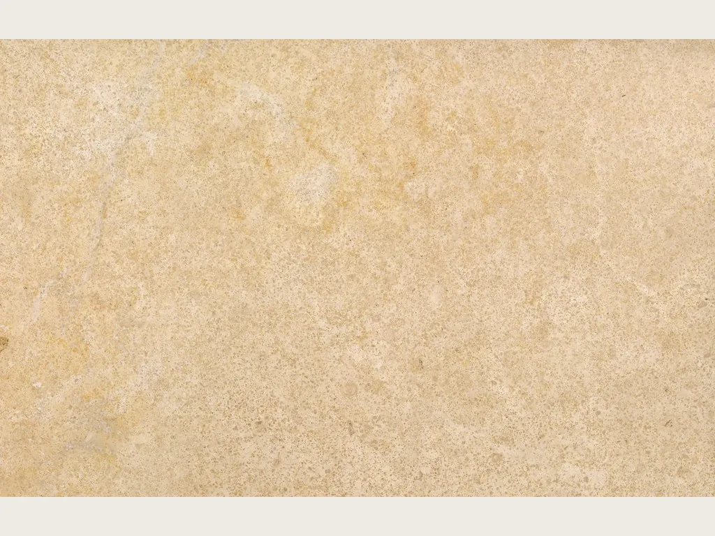 Slab of beige Trani marble: golden beige with fine mottled grain and a matte finish, no veins