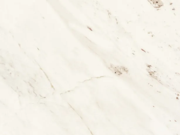 Detail of white Venus marble: fine gray veins and beige patches on the polished white