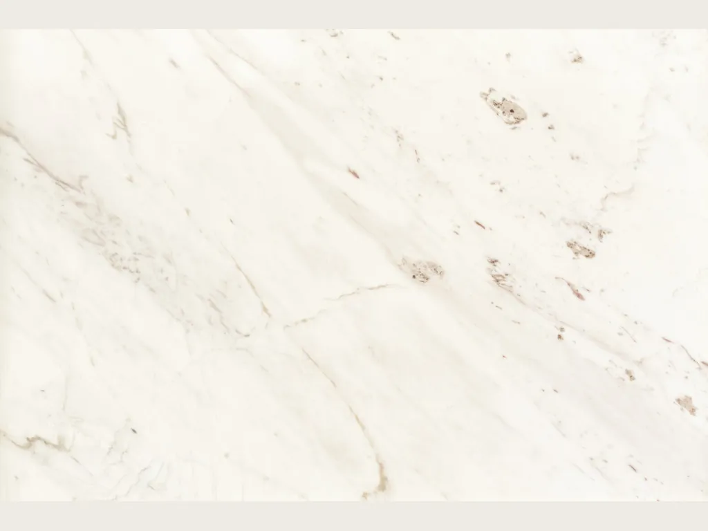 Slab of white Venus marble: a warm white with faint gray veins on the diagonal and isolated beige patches