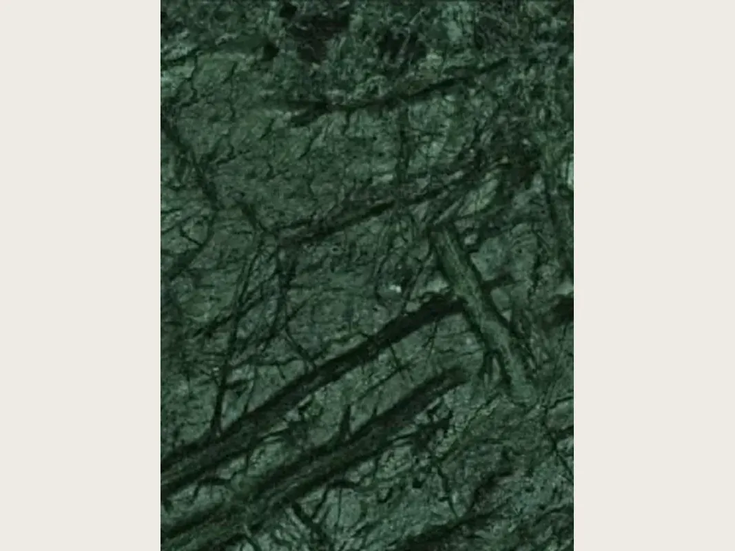 Verde Guatemala marble slab: dark green background with a diagonal network of light green veins