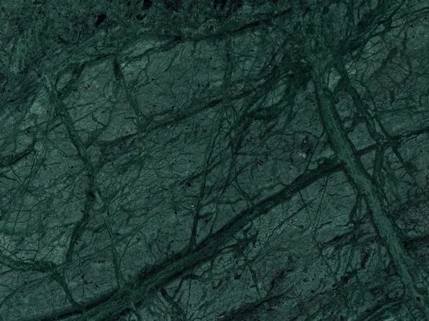 Verde Imperiale close-up: fine light green strokes crossing diagonally over the dark background