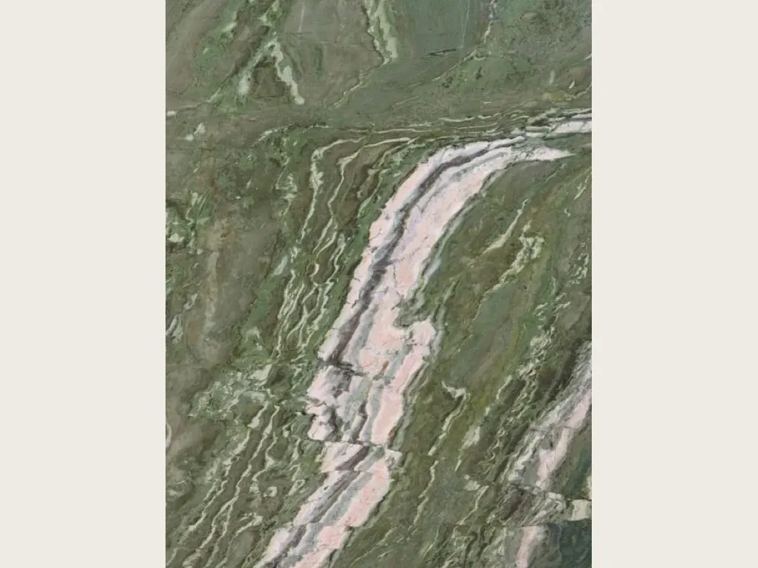 Slab of green Brioches onyx: grayish green with a wide pink and white band crossing it diagonally