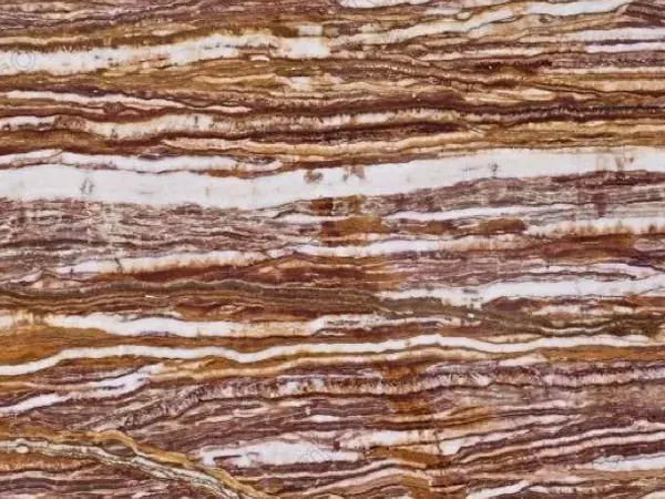Slab of Fantastico Onyx: high-contrast parallel horizontal bands of white, reddish and ochre