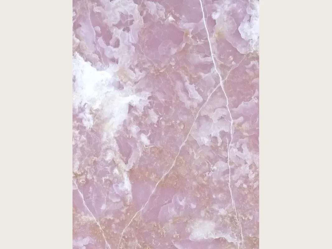 Pink Onyx slab: lilac pink background with white clouds and fine diagonal veins