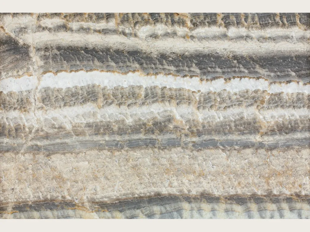 Velluto gray onyx slab: wavy horizontal bands of gray, white and beige on a gray and cream background