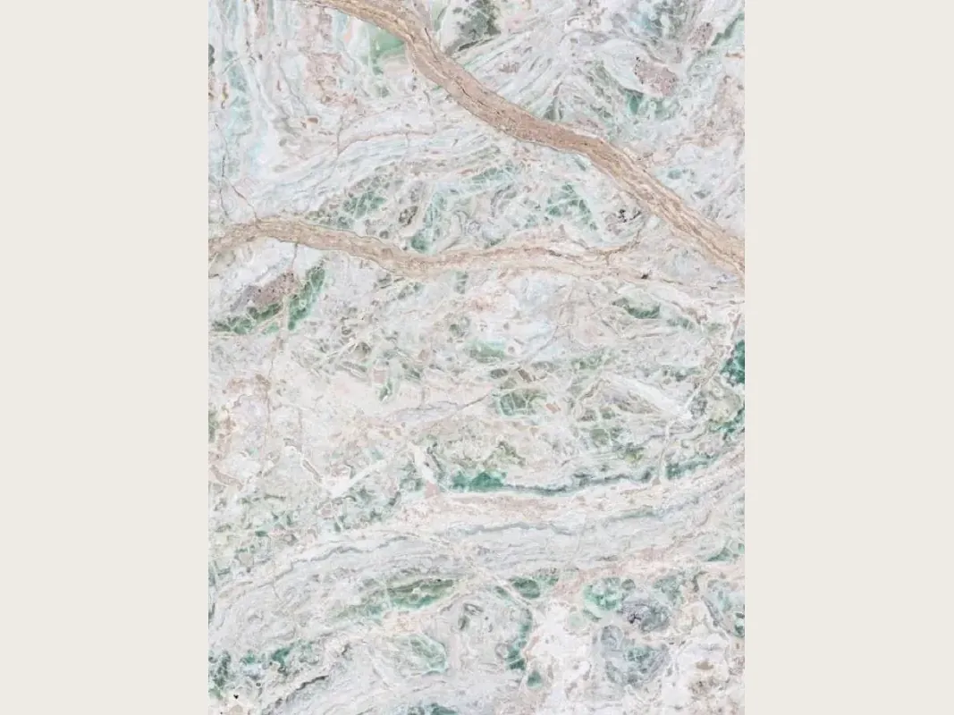 Verde Himalaya onyx slab: greenish white background with wavy dusty pink veins and mint green patches