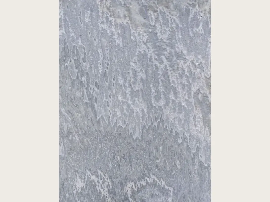 Vulcano onyx slab: wavy light patches that fall in vertical lines over bluish gray
