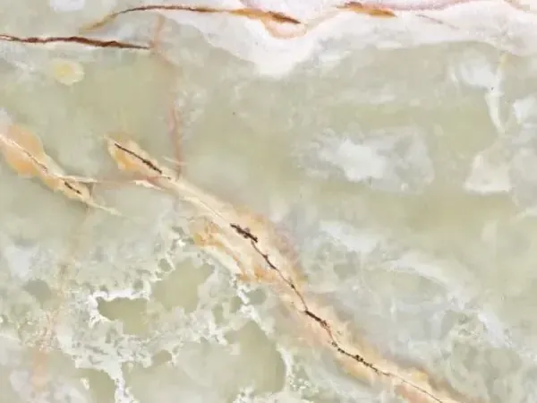 Green onyx slab: pale green background with beige and brown diagonal veins