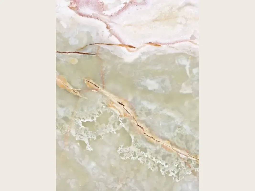 Green onyx slab: pale green background with beige and brown diagonal veins