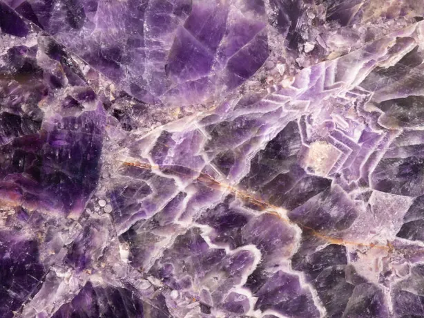 Amethyst detail: zigzag bands between violet crystals, high polish