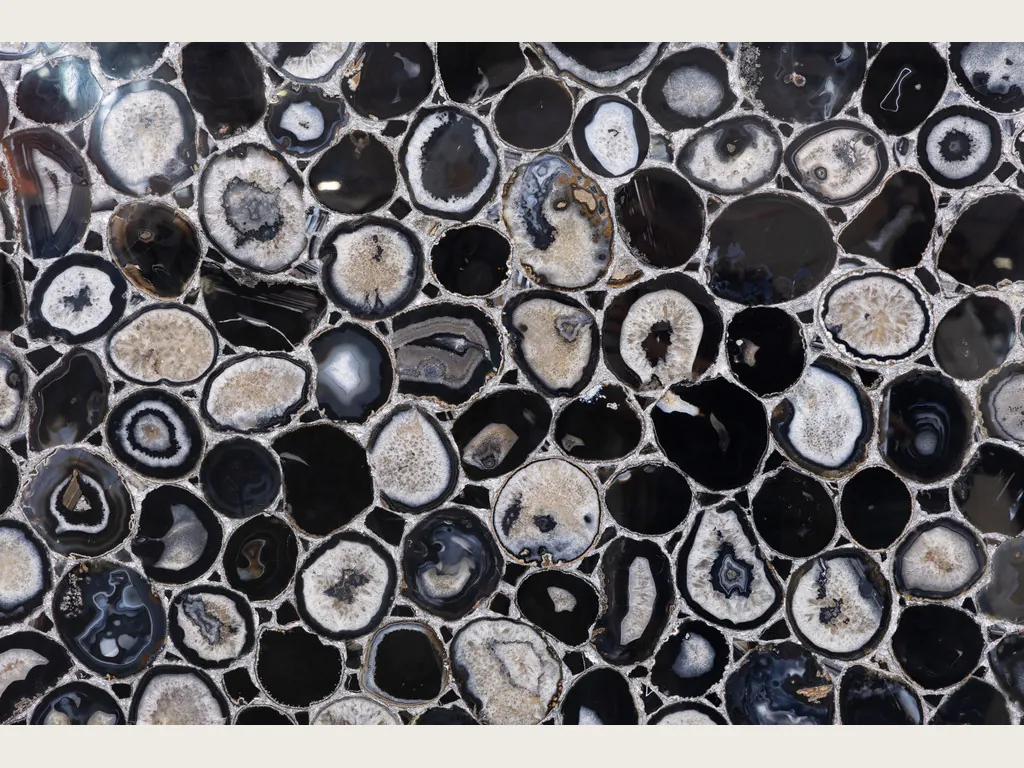 Black Agate with Silver Leaf slab: mosaic of round slices with gray and white rings and silver joints