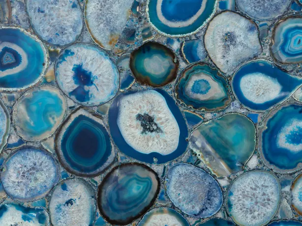 Detail of blue agate slices with concentric rings and a crystalline center