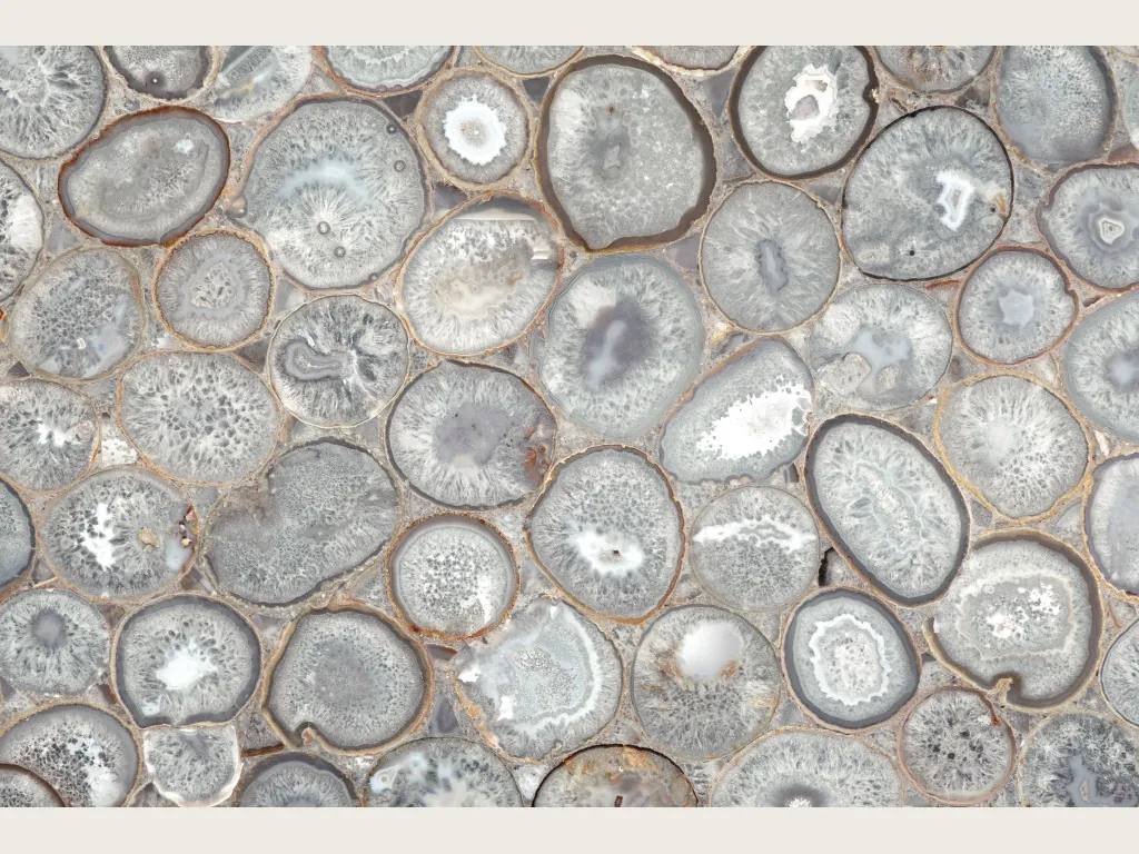 Crystal agate slab: a mosaic of rounded slices with gray edges and white centers