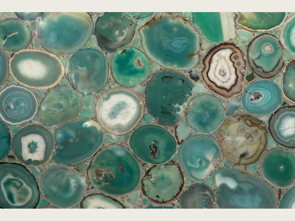 Green agate slab: slices with green rings and light centers on a blue-green background