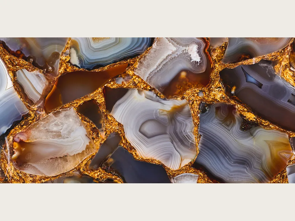 Gray Agate with Gold Leaf slab: mosaic of gray, brown and orange pieces joined by gold joints