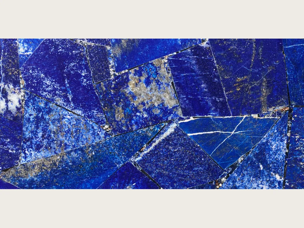 Lapis lazuli slab: mosaic of angular ultramarine pieces with white flecks and gold dots