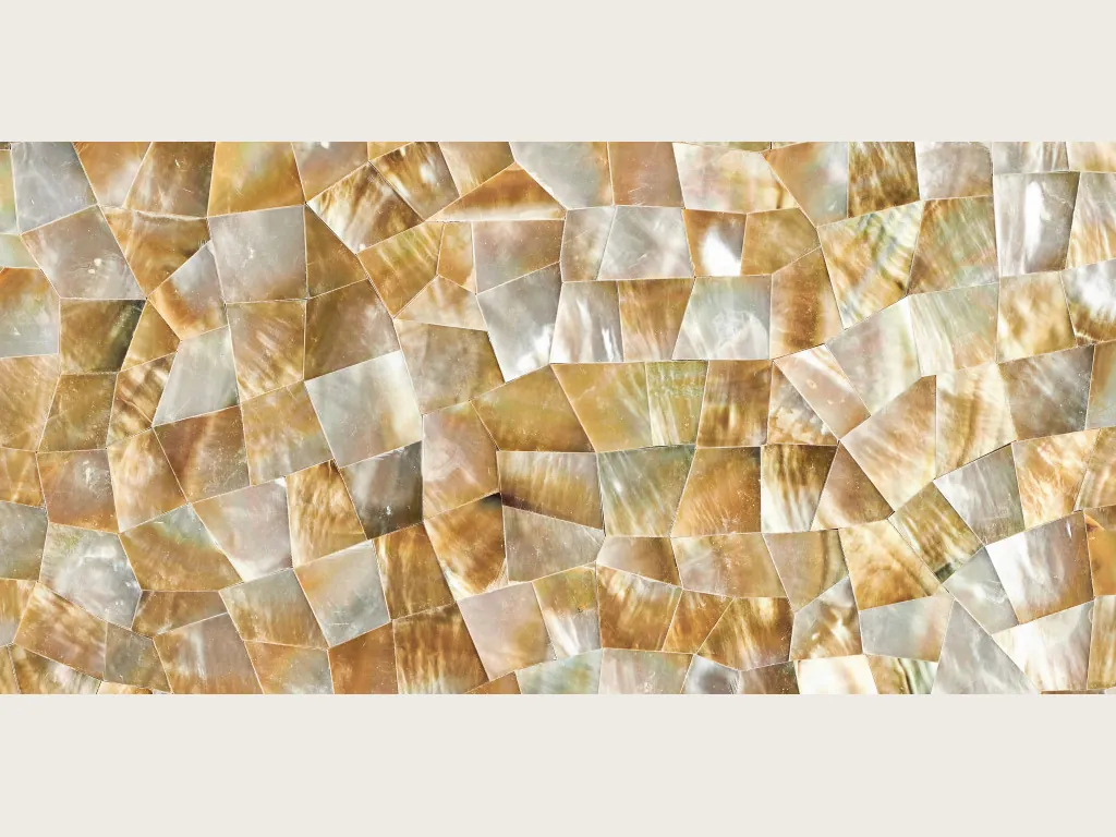 Golden shell mother of pearl slab: angular pieces in honey gold and pearly white with iridescent highlights