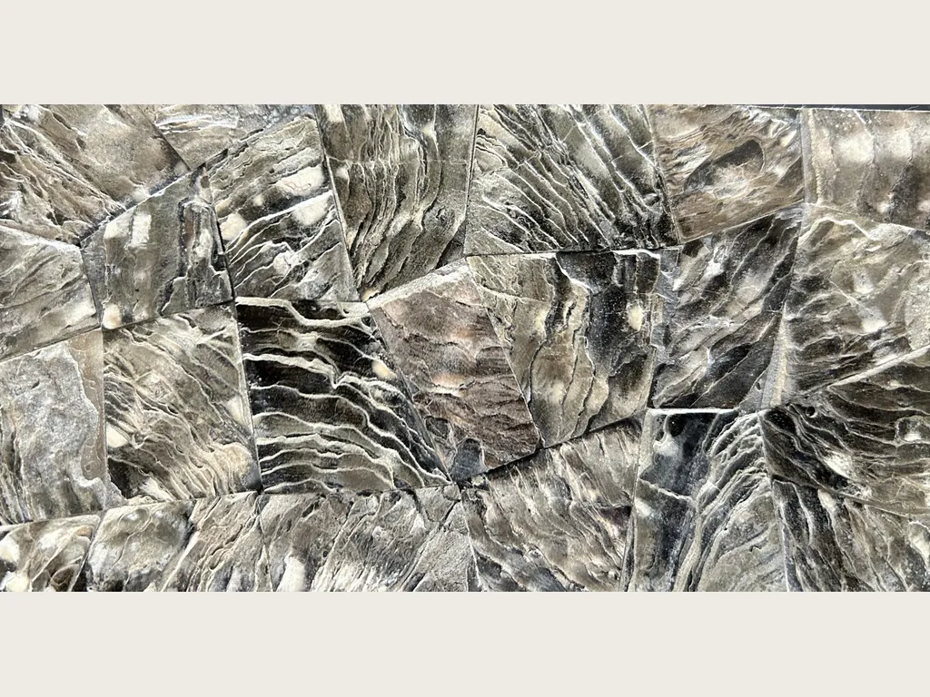 Galushell Gray Mother of Pearl slab: a mosaic of shell pieces with wavy striations and a metallic sheen