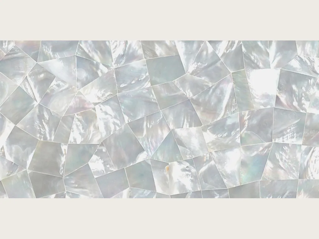 Pinctada Maxima mother of pearl slab: mosaic of angular pieces in pearly white with a soft sheen