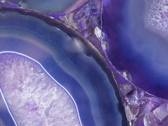 Purple Agate detail: violet concentric bands and a crystalline lilac center