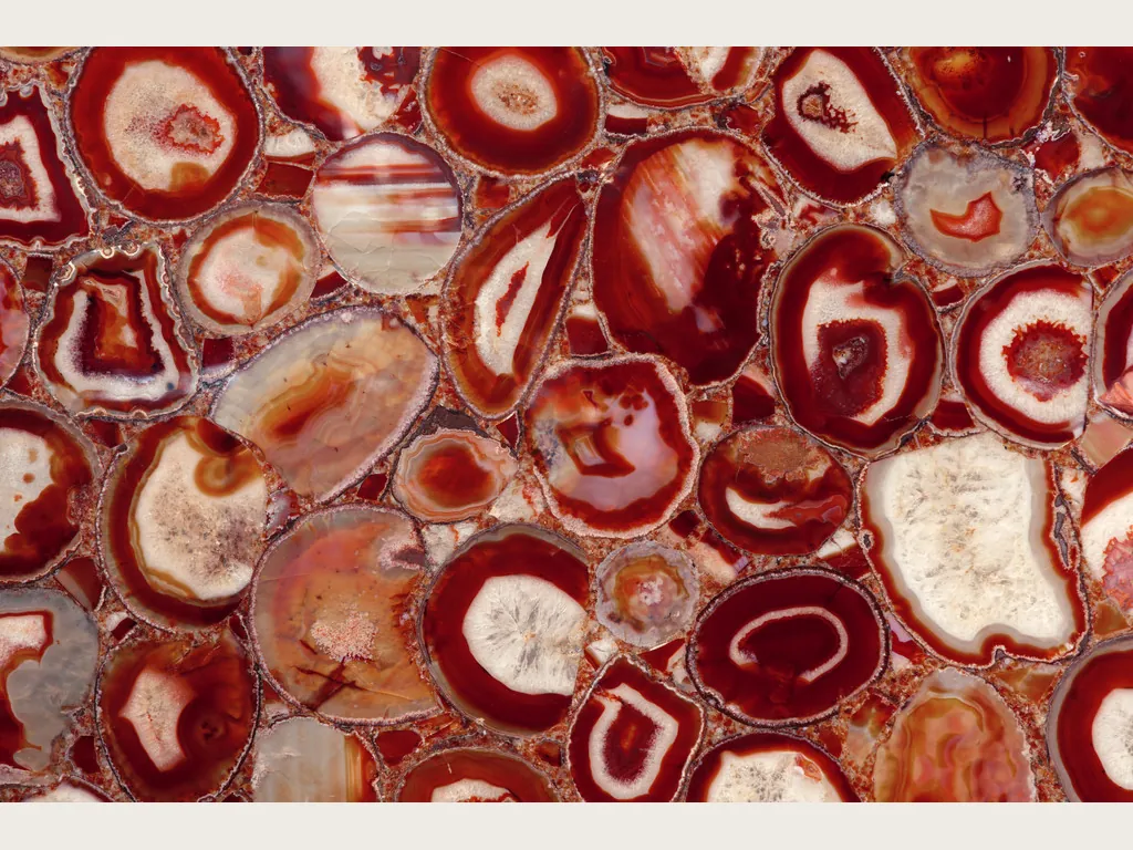 Red agate slab: a mosaic of rounded slices with red rings and cream centers