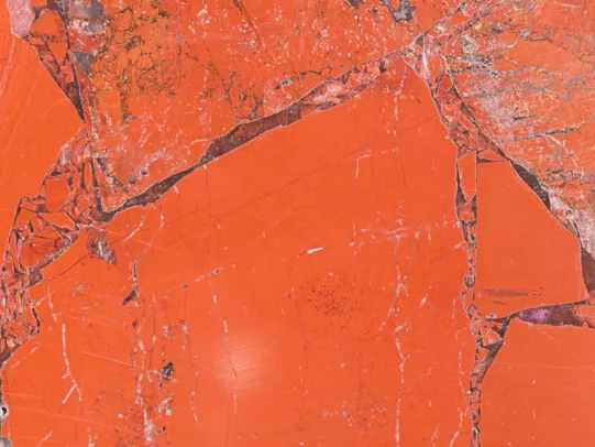 Detail of Red Jasper: the glossy polish over the pieces and their fine gray joints