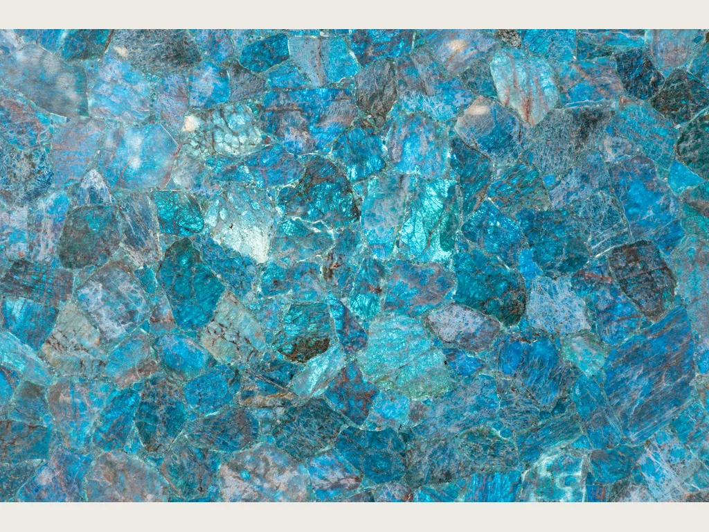 Sea Quartz slab: mosaic of turquoise, blue and white fragments with a polished shine