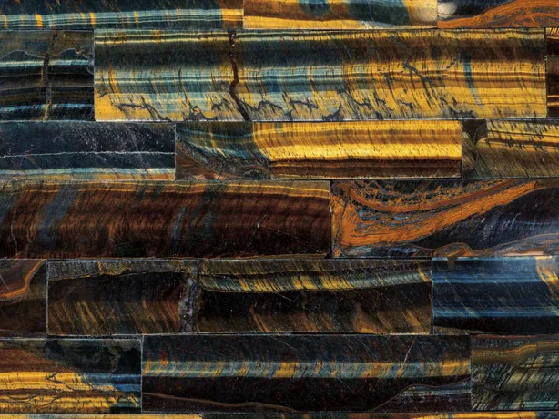 Detail of blue and gold tiger's eye: alternating stripes within each band, with a polished sheen