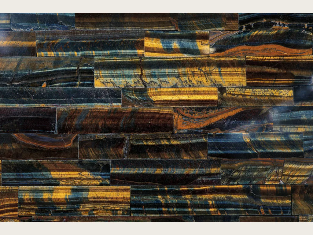 Blue and gold tiger's eye slab: a mosaic of bands with blue, golden and orange stripes
