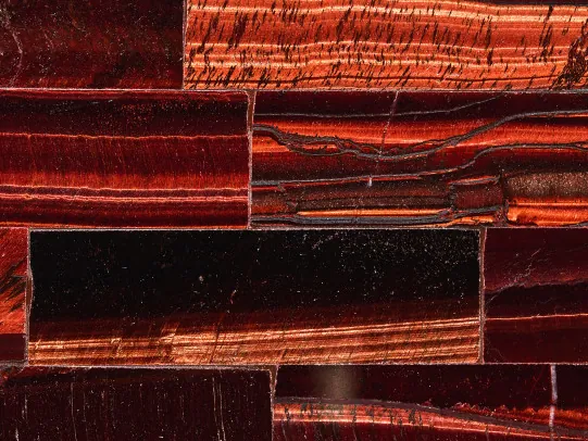 Red tiger's eye detail: copper and burgundy bands with the shifting sheen of the polish