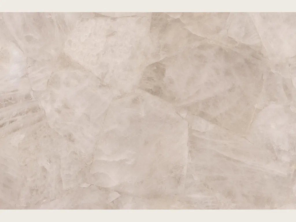 Accent wall clad in White Quartz above a low wooden cabinet: crystalline, soft grayish white with barely marked fragments