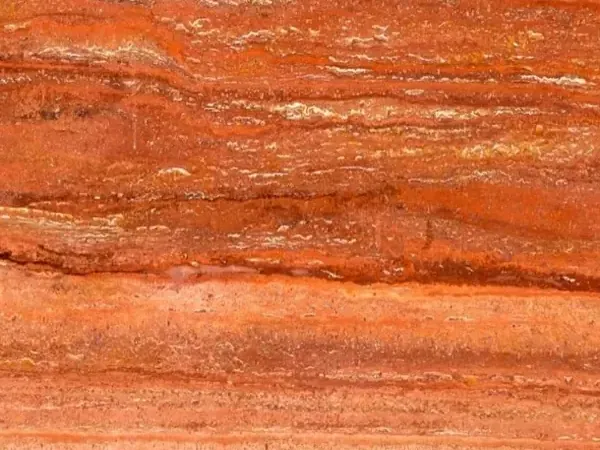 Red travertine slab: parallel horizontal bands in red, orange and cream over an orange-red background