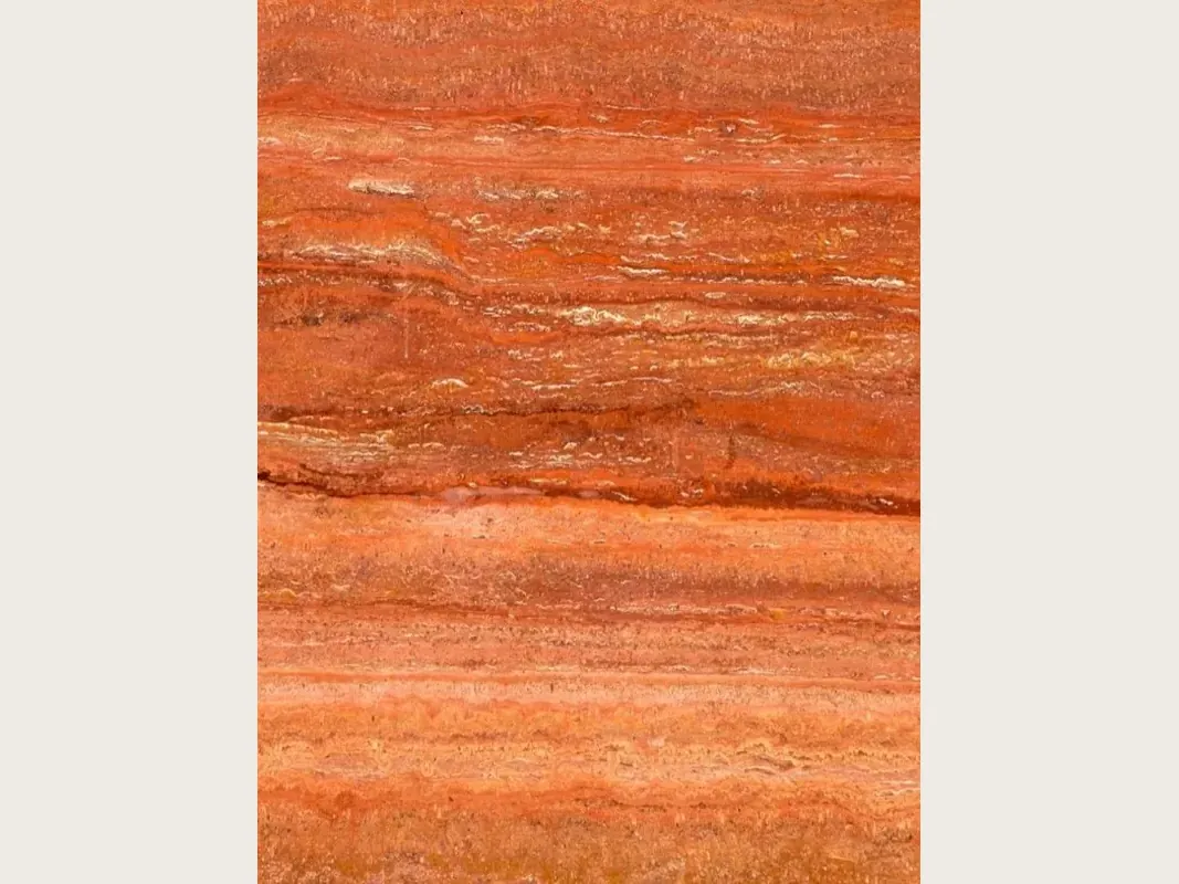 Red travertine slab: parallel horizontal bands in red, orange and cream over an orange-red background