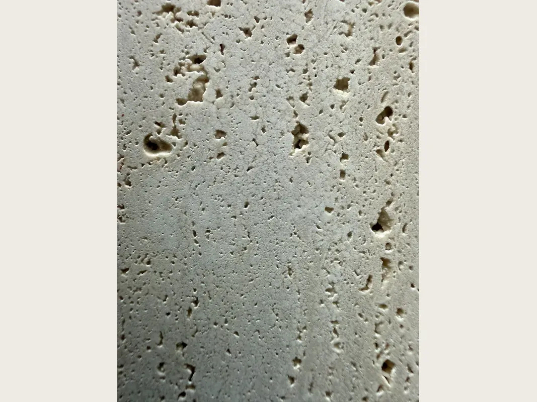 Beige Roman travertine slab: light grayish beige background with open holes in vertical rows