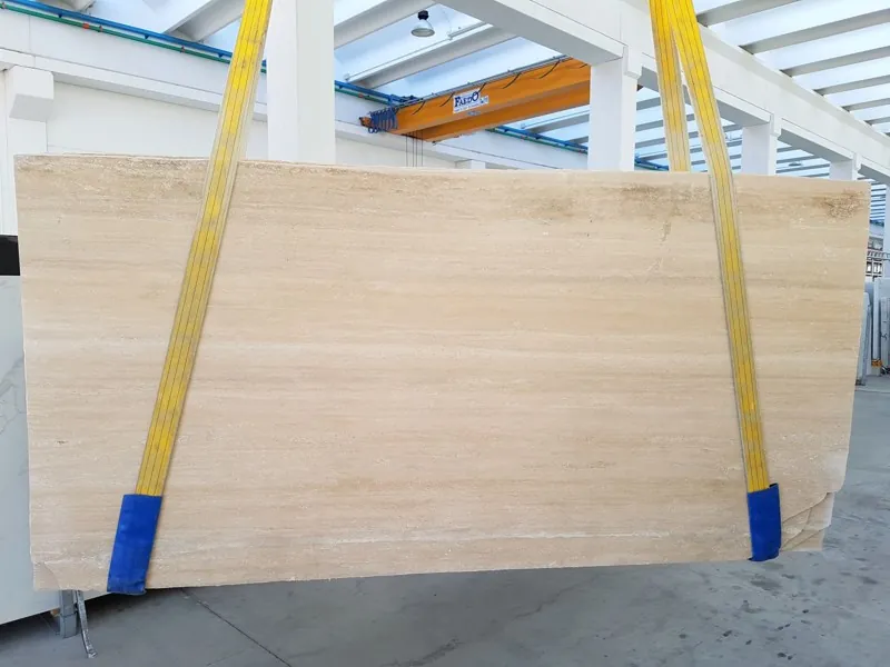 Slab of beige Classic travertine: speckled beige with dark holes in vertical columns (another slab)