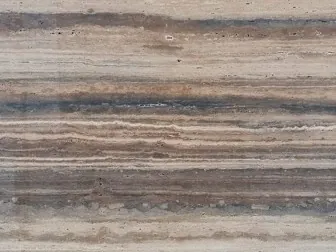 Close-up of brown Dark Silver travertine: parallel dark brown and beige bands over the grayish brown background