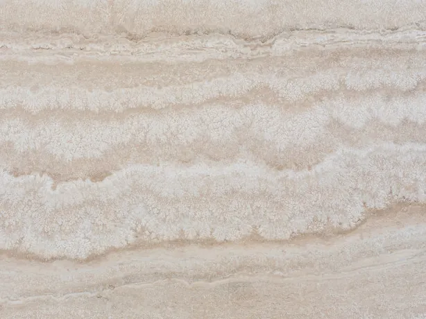 Close-up of beige Paglierino travertine: horizontal waves in very close cream tones