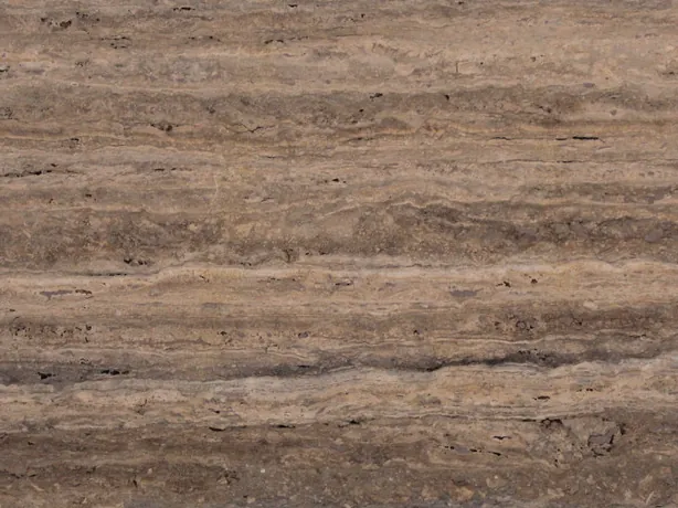 Close-up of brown Pantheon travertine: natural pores and fine lighter bands over the brown