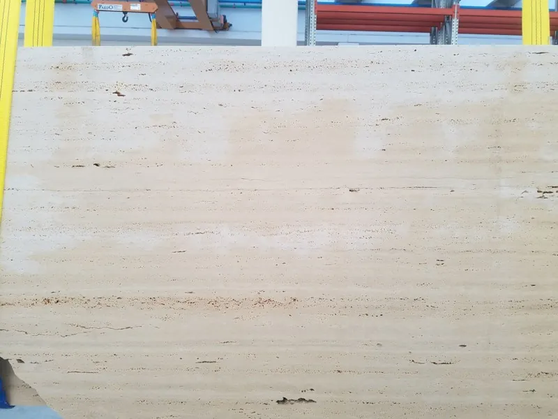Light beige Roman travertine slab: cream background with fine horizontal lines and small aligned pores