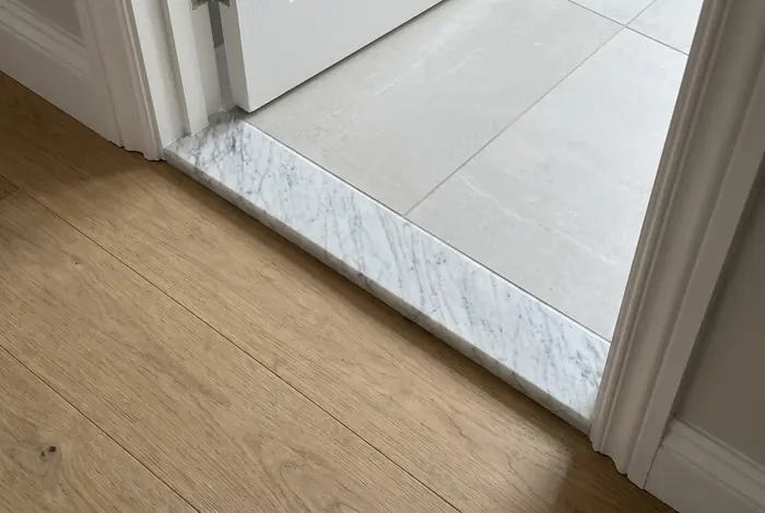 Carrara marble threshold in a doorway