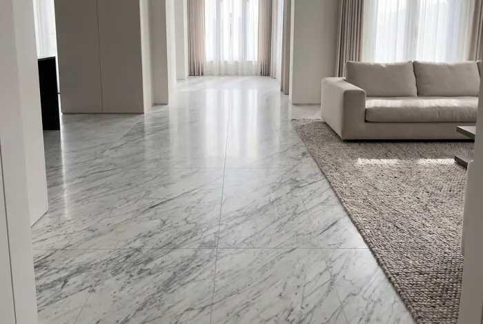 Living room with a large-format polished Carrara marble floor